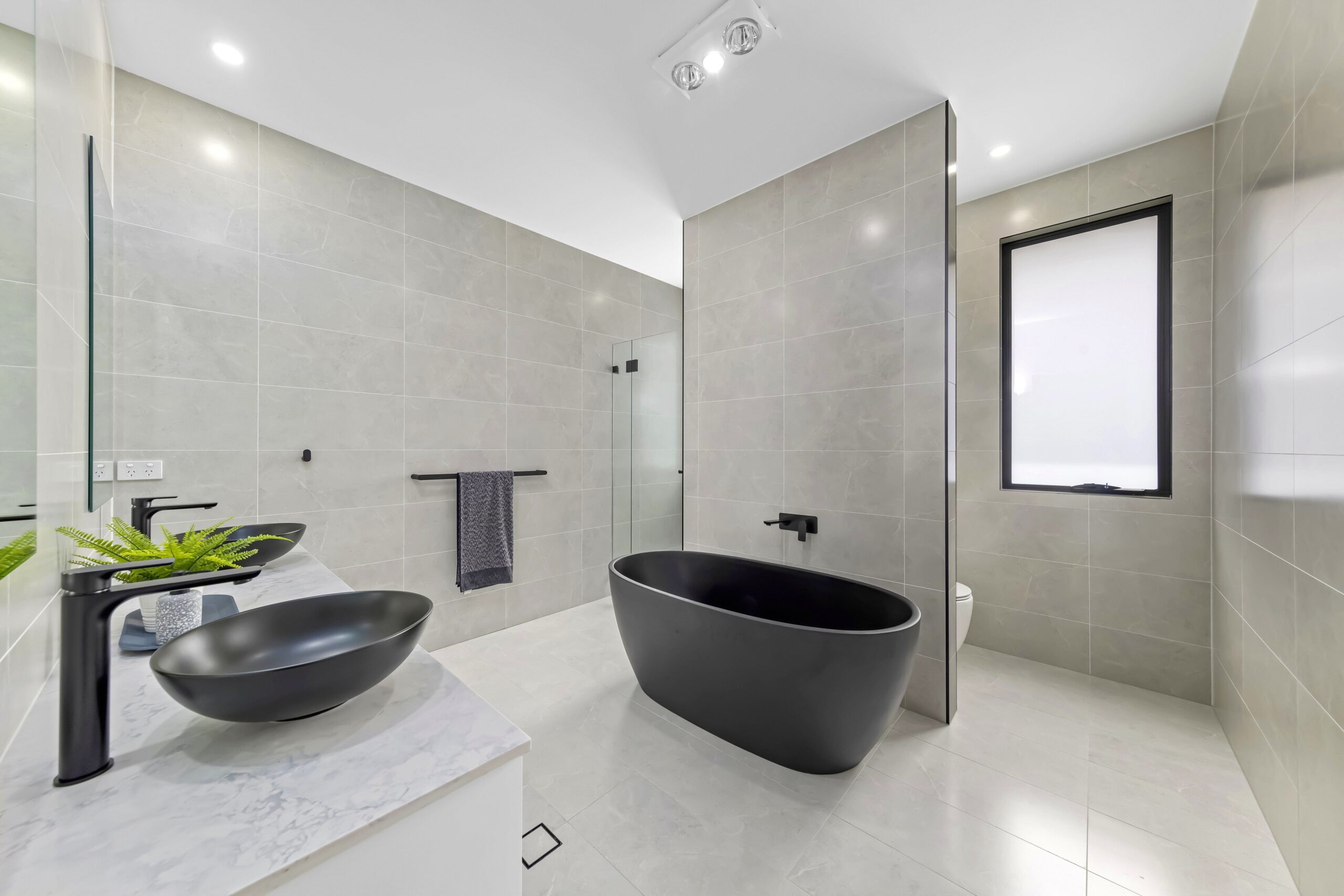 Bathroom with a tub sink and shower