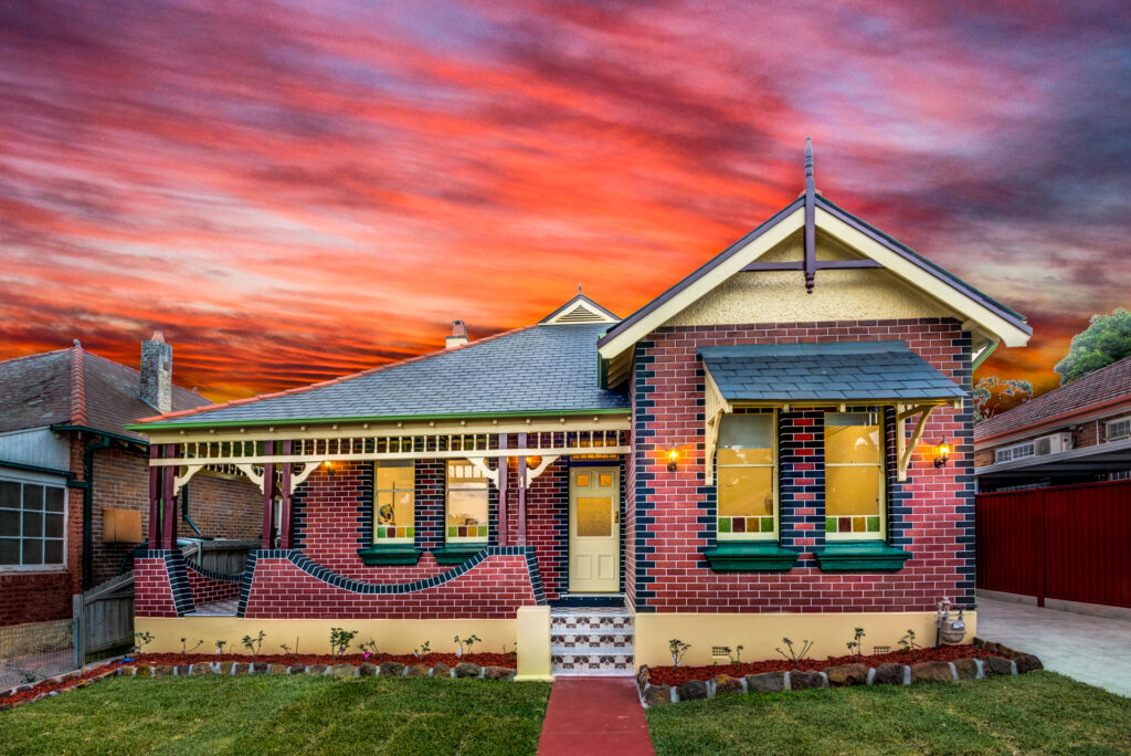 A heritage style home with a roof at sunset in Sydney