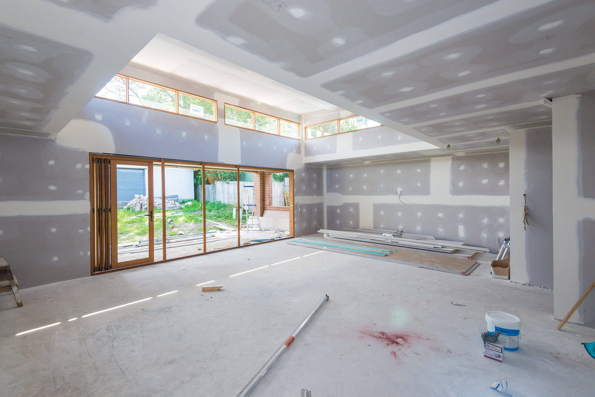 Under construction commercial space with large glass door