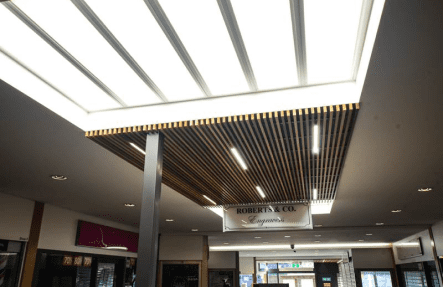 A ceiling with bright lights in a mall
