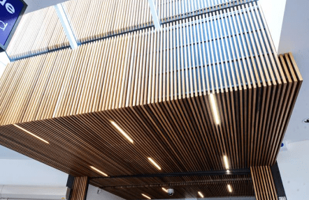 The wooden ceiling of commercial store with tube lights